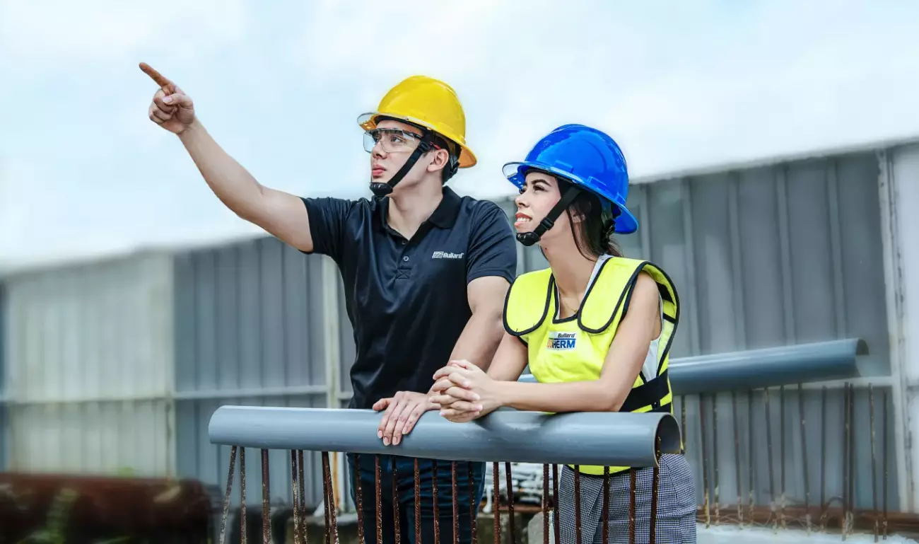 Workers pointing at something